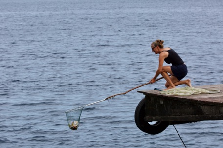 Karin helps with the daily rubbish-fishing