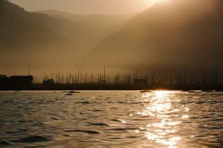 the sun rises behind the mountains the sun rises behind the mountains