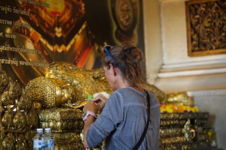 ... and stick gold on Buddhastatues, for luck and good health